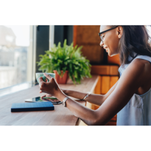 Women looking out window in house