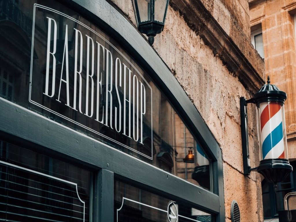 Image of the outside of a small business barbershop